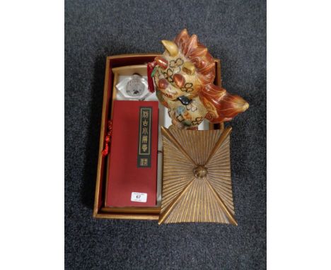An oriental style lacquered tray, miniature folding screen, scent flask and a ceramic lion figure.