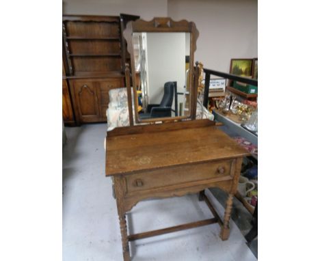 A twentieth century oak dressing table on bobbin legs 