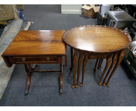 A nest of three pie crust edge occasional tables together with a mahogany flap sided sofa table 