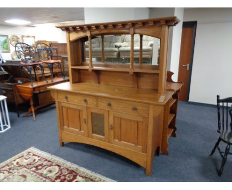 An oak Arts and Crafts mirror backed sideboard with inset copper panel  CONDITION REPORT: 168cm long by 56cm deep by 178cm hi