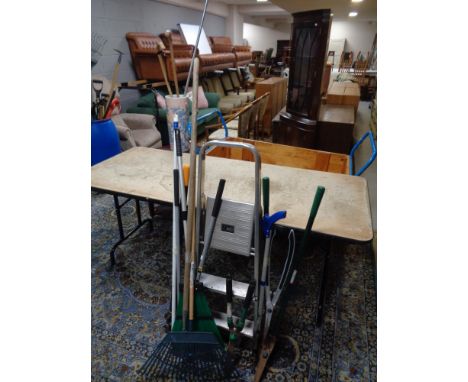 A set of folding aluminium step ladders and quantity of garden tools 