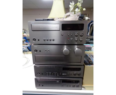 A four piece Yamaha stereo system with remote control CONDITION REPORT: This has not been fully tested but all four parts hav