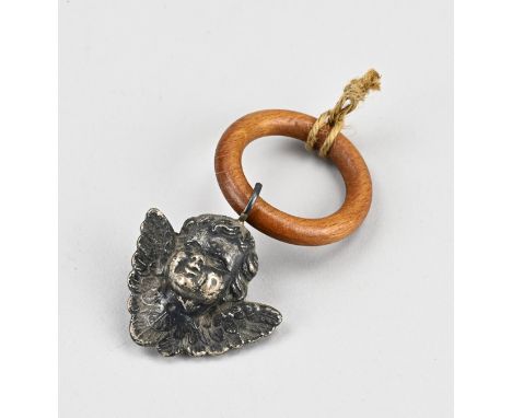 Silver rattle, 925/000, with a pendant in the shape of a putti head. On a wooden ring. 11 cm. approx. 25 grams.
