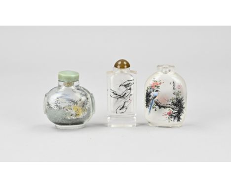 Three old Chinese glass snuffbottles with back-glass painting. Size: H 6,5 - 7,5 cm. In good condition.