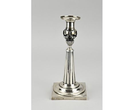 Silver candlestick, &gt;800/000, on square base with a round pillar, ending with line decoration. The light of the candlestic