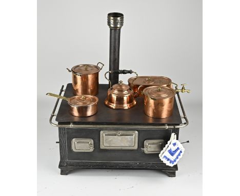 Antique German children's stove made of tin, with original copper pans. With chimney. Circa 1910. Possibly Märklin or Bing. D