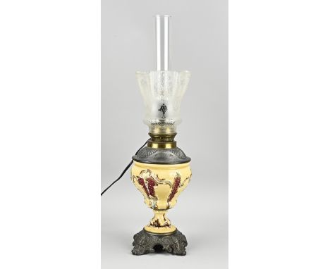 Antique electrified majolica kerosene lamp with composition metal. Circa 1900. Dimensions: H 56 cm. In good condition.