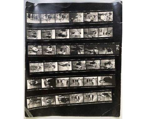 A contact sheet print with 36 images of The Rolling Stones in London, taken by photographer Roger Viollet. Sheet is 12 x 10".