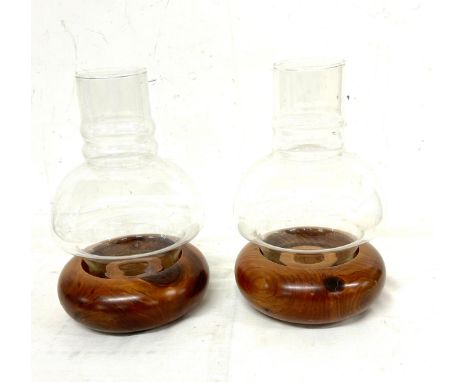 A pair of wooden candle holders with an oil lamp style flute height approx 8 inches 