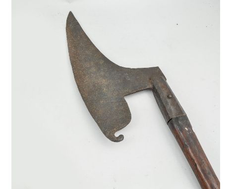 A wagoners axe, 16th century, 44cm blade, stamped numeral XIII. stained wood shaft, overall length approximately 149cms.