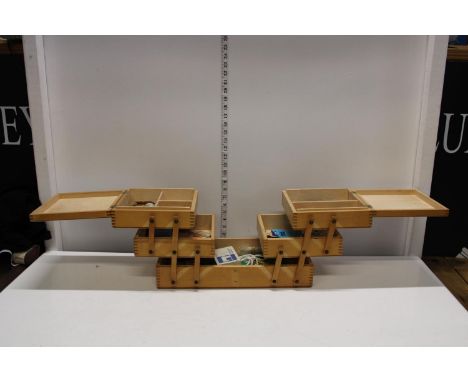 A vintage cantilever wooden sewing box and contents 