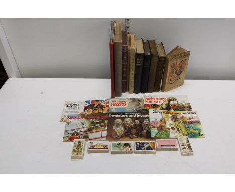 A job lot of vintage books and annuals with collectors cards etc 