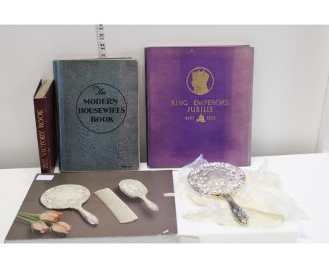 A boxed silver plated dressing table set and vintage books 