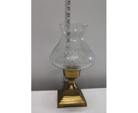 A brass based hurricane candle lamp 