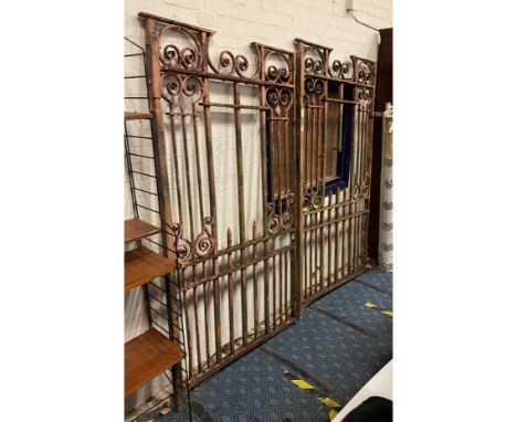 PAIR OF WROUGHT IRON GATES Each gate is 190cm high 102cm wide.
