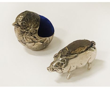 EARLY SILVER PIG PIN CUSHION WITH A SILVER PLATED ROBIN PIN CUSHION