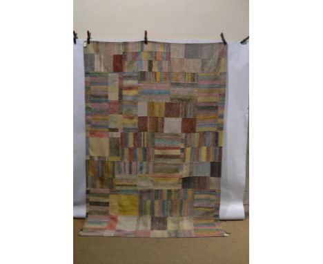 Attractive multi-coloured kelim patchwork-design carpet, 8ft. 6in. x 6ft. 8in. 2.59m. x 2.03m. Lined with pale blue cotton.