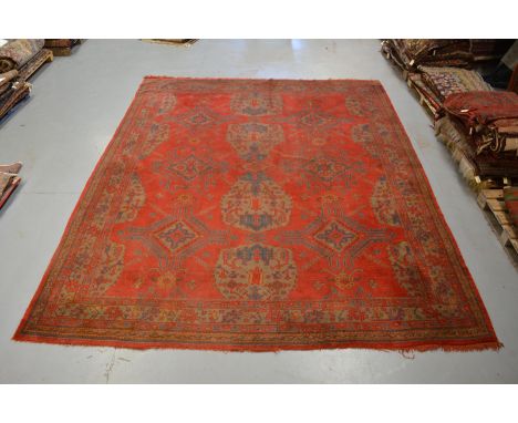 Good Ushak carpet, west Anatolia, early 20th century, 13ft. 10in. x 11ft. 2in. 4.22m. x 3.40m. Slight wear in places. Note th