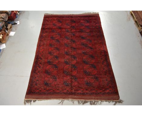 Afghan 'Taghan' carpet, Afghanistan, about 1930s, 11ft. 10in. x 7ft. 10in. 3.60m. x 2.39m. Slight wear and small areas of mot