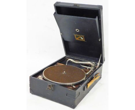 A mid 20thC HMV table record player, of rectangular form in pressed leather case, with brown baize, 24cm dia turntable and ar