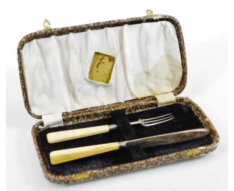 A 19thC silver entree knife and fork set, each with a ivory handle, associated case, lacking date letters, the knife 18cm wid