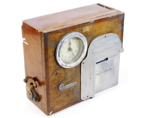 A Gensign mahogany cased pigeon racing timer clock, 32cm high, 35cm wide.