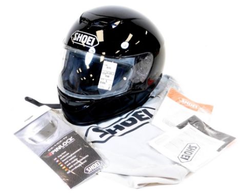 A Shoei Raid II crash helmet, in black, W-12 with British Motorcycle Sport label numbered 519915, with chin strap and retail 