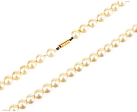 A synthetic pearl necklace, with cylindrical claps, marked 9ct, 36cm long.