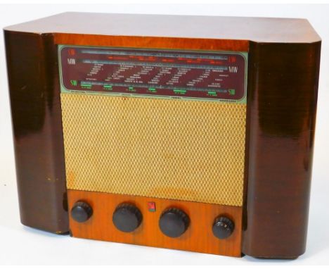 A vintage Ferranti 115 walnut cased radio, 115 50/100 cycles in shaped case with grill speaker front and four tuning knops, 3