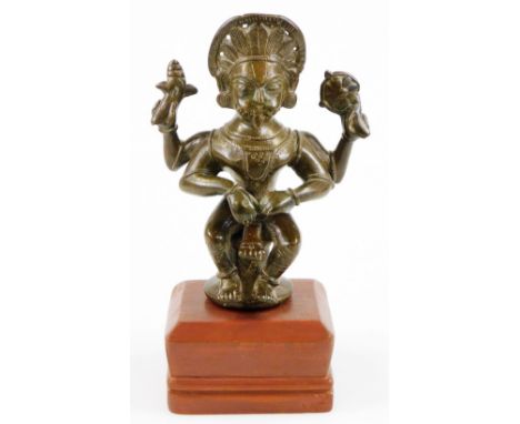 A late 18th/early 19thC South Indian Narasimha bronze figure of Vishnu, on a wooden plinth base, 27cm high.