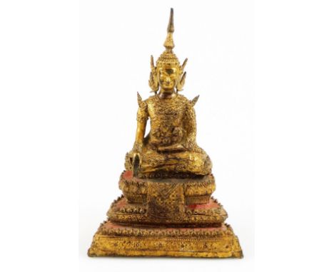 A late 19thC/early 20thC Thai Rattanakosin bronze Buddha, on a seated figure, on stepped base partially textured with gilt hi