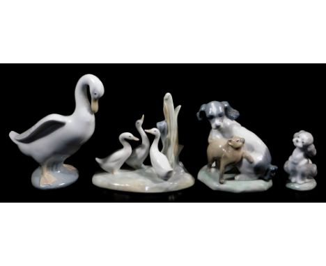 Three Nao figures, comprising goose, 15cm high, puppy and cat group, geese in naturalistic setting, and a Lladro Society 2000