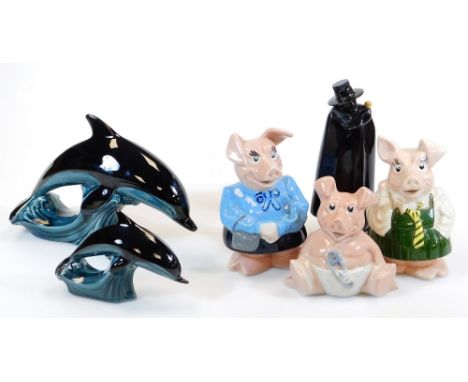 A graduated pair of Poole Pottery dolphin figures, 20cm high, Natwest Pigs, etc. (a quantity)