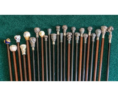 Twenty four recent pommel topped walking canes, plated and ceramic (24)Note: located at the vendor's property in South Derbys