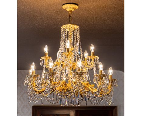 A gilt metal fifteen light pendant electrolier with cut glass droppers, drop approximately 95cmNote: located at the vendor's 