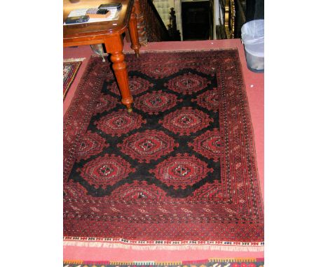 Middle Eastern carpet with dark red ground and geometric border - 190cm x 135cm