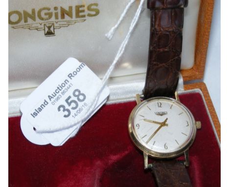 A gent's vintage gold cased Longines wrist watch in original box