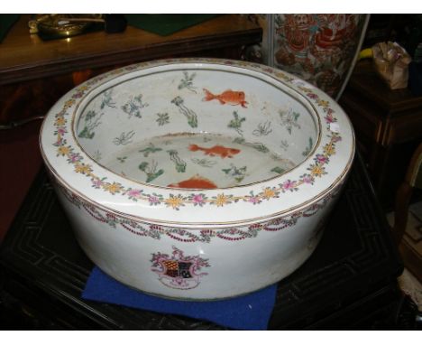 An old oriental armorial ceramic bowl, having hand painted Carp decoration to the interior and a signature to base - 46cm dia