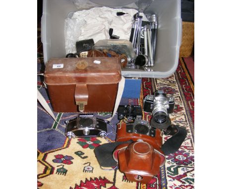 A single collection of early cameras, camera lenses, cine camera, etc