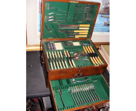 A Walker & Hall oak cased part canteen of cutlery
