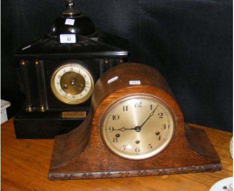 A Victorian slate mantel clock, together with an oak cased striking mantel clock