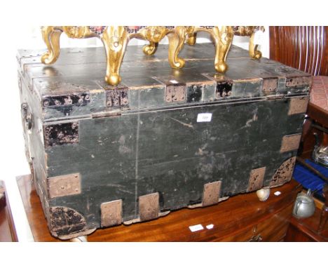 An antique metal bound wooden trunk