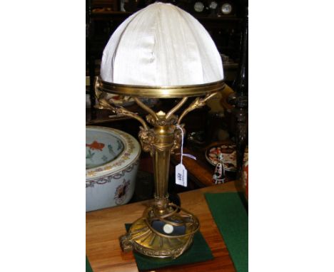 A 46cm high elegant table lamp with stylized Ram's head decoration