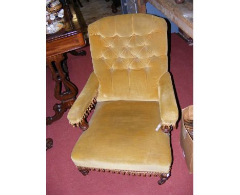 A late Victorian armchair with button backrest