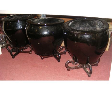 Three large Meiping oriental ceramic garden pots on wooden stands