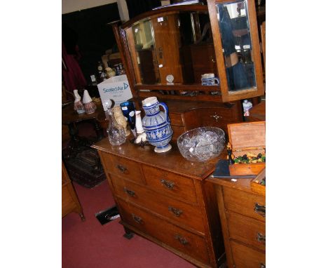 An oak dressing table with mirror over