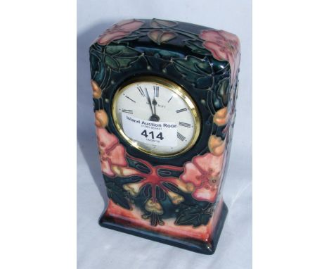 A Moorcroft pottery mantel clock - 16cm high - signed to the base