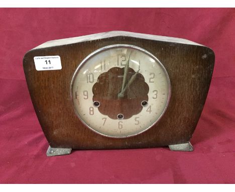 A Smiths oak cased chiming mantel clock
