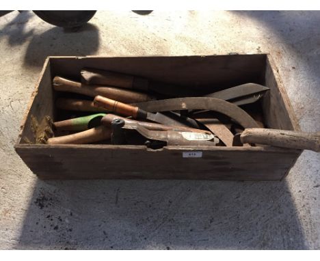 A box and contents of various sickles, garden hand tools etc.