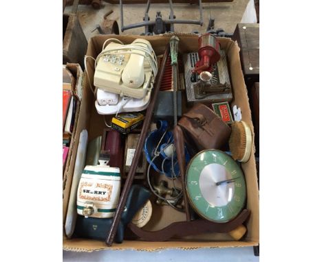 A large box of miscellaneous items to include a leather covered swagger stick, a Vintage pencil sharpener, Smiths retro wall 